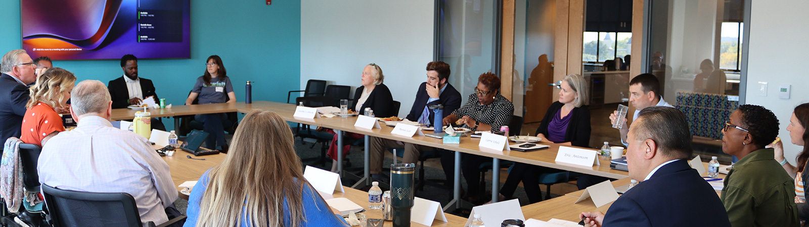 The Greater Milwaukee Foundation and Otto Bremer Trust staff meet in a conference room.